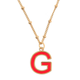 Necklace with ball chain and fuchsia enamel initial