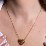 Necklace with curved heart pendant