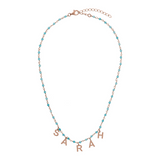 Rosary necklace with colored stones and hanging letters