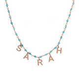 Rosary necklace with colored stones and hanging letters
