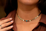 Snake necklace with colored center